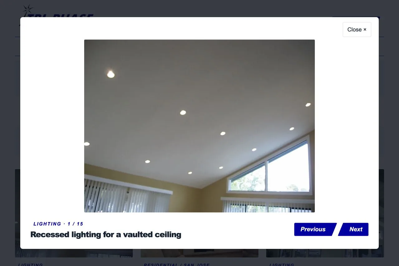 Tri-Phase enlarged project photo viewer with a lighting installation, caption, photo count, and Previous, Next, and Close controls